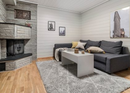 A living room filled with furniture and a fire place
